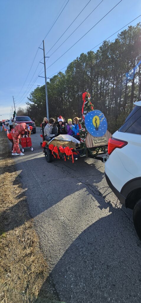 Edison students riding a decorated float in the community Christmas parade
